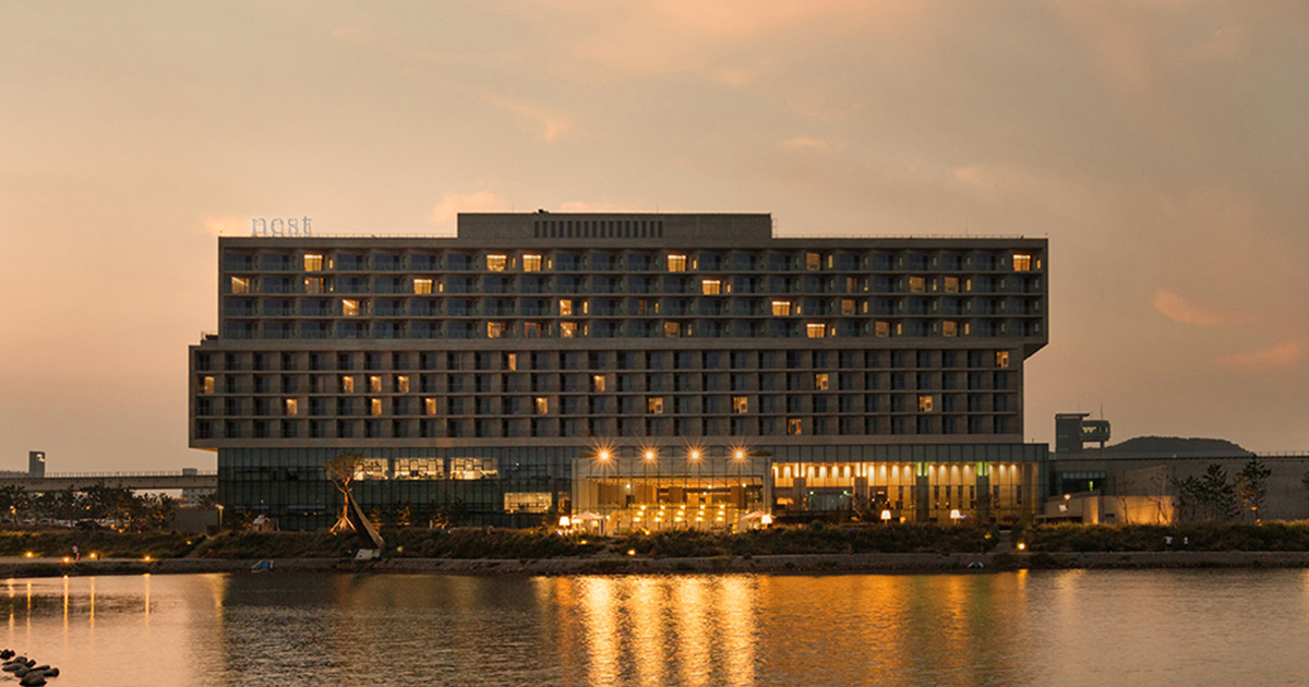 Nest Hotel Incheon exterior at sunset