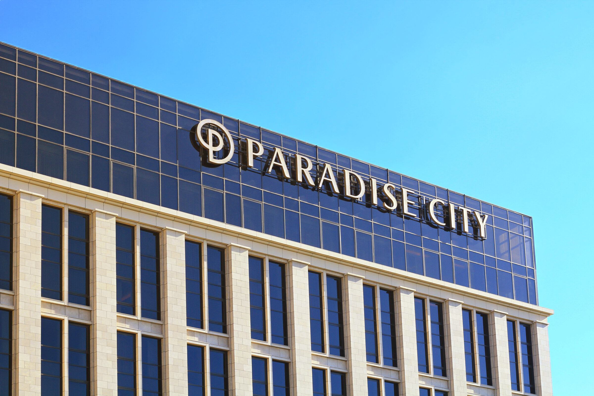 Paradise City resort tower under a clear sky